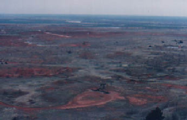 A lone pumping unit noisily labors to draw crude from beneath the colorful palette of the Orienta Plains.