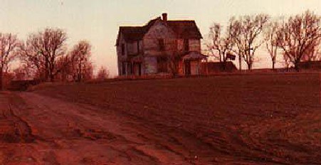 Whispers of sounds echo in the eaves, a trace of a scent, a breath of cool air.  What memories lurk amid the dust motes and splintered wood here?
